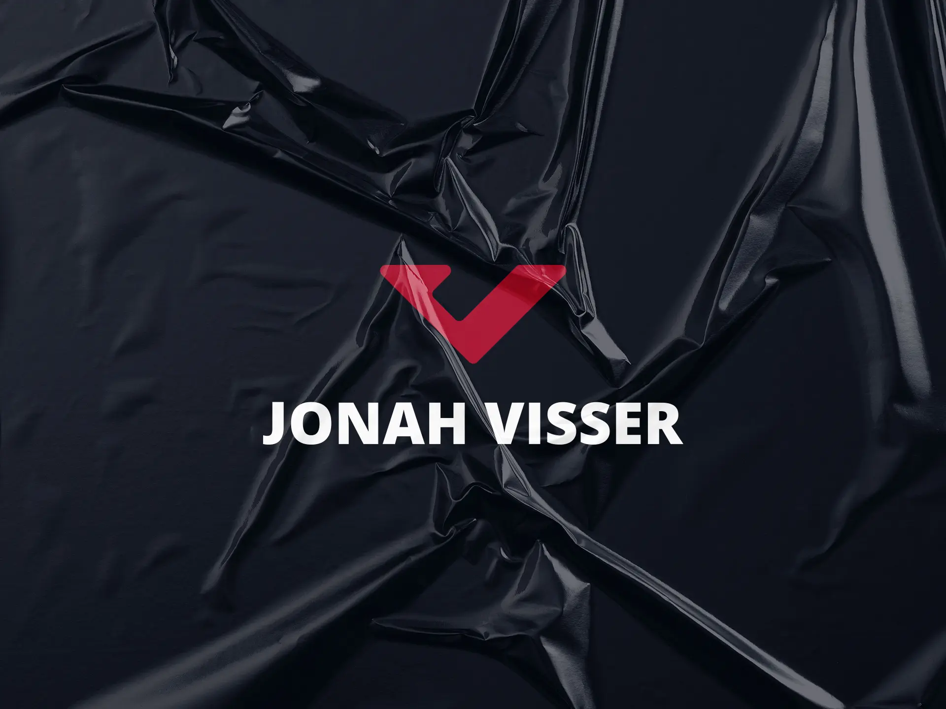 Jonah Visser´s under a wrinkled plastic on a black background.
